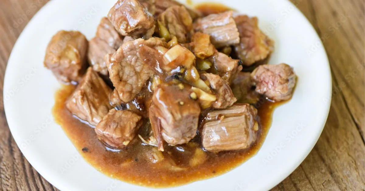Crock Pot Cube Steak and Gravy served with mashed potatoes.